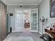 Living room leads to the hallway and features chandelier, hardwood floors, and custom decor at 2590 Tarpon Cove Dr # 811, Punta Gorda, FL 33950