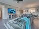 Comfortable living room with a plush sectional sofa, entertainment center, and open view to the dining area at 2590 Tarpon Cove Dr # 811, Punta Gorda, FL 33950