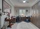 Spacious office with custom wood cabinets, large desk, and ceiling fan at 2590 Tarpon Cove Dr # 811, Punta Gorda, FL 33950