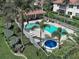 Community pool and spa area surrounded by lush landscaping, providing a resort-like experience at 2590 Tarpon Cove Dr # 811, Punta Gorda, FL 33950