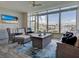 Relaxing sunroom with floor-to-ceiling windows, plush seating, a TV, and water views at 2590 Tarpon Cove Dr # 811, Punta Gorda, FL 33950