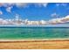 Beach with a clear blue sky and clouds at 2700 N Beach Rd # B205, Englewood, FL 34223