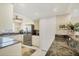 Bright kitchen featuring stainless steel appliances, stone countertops, and neutral cabinetry at 2700 N Beach Rd # B205, Englewood, FL 34223