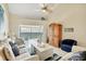 Comfortable living room with ocean views, a ceiling fan, and a cozy decor at 2700 N Beach Rd # B205, Englewood, FL 34223
