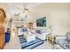 Charming living room with high ceilings, a loft and coastal decor at 2700 N Beach Rd # B205, Englewood, FL 34223