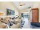 Comfortable living room with ocean views, stylish decor, and ceiling fan at 2700 N Beach Rd # B205, Englewood, FL 34223