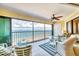 Bright sunroom with wicker furniture and beautiful ocean views at 2700 N Beach Rd # B205, Englewood, FL 34223