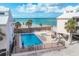 Aerial view of community pool and beach access, perfect for relaxation and enjoying beachside living at 2700 N Beach Rd # B205, Englewood, FL 34223