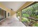 Inviting screened patio offering serene views of the lush backyard landscaping and garden at 2758 Morrietta Ln, North Port, FL 34286