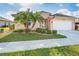Charming single-story home with well-manicured lawn and lush tropical landscaping in a sunny locale at 278 Crystal River Dr, Englewood, FL 34223