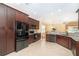 Spacious kitchen featuring modern appliances, granite counters, and ample cabinet storage at 278 Crystal River Dr, Englewood, FL 34223