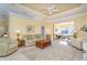 Spacious living room with neutral tones, tray ceiling, and open layout at 278 Crystal River Dr, Englewood, FL 34223