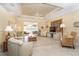 Open living room with tray ceiling, comfortable seating, and lanai access at 278 Crystal River Dr, Englewood, FL 34223