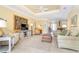 Inviting living room featuring tile floors, tray ceiling, and comfortable seating at 278 Crystal River Dr, Englewood, FL 34223