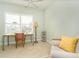 Bright office space featuring neutral colors, desk, shell lamp, and white shutters at 278 Crystal River Dr, Englewood, FL 34223