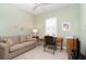 Bright office space featuring a cozy sofa, desk, and beach-themed decor at 278 Crystal River Dr, Englewood, FL 34223