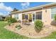 Charming patio area with stone landscaping and easy access to the screened lanai at 278 Crystal River Dr, Englewood, FL 34223