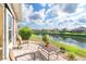 Scenic patio overlooking a tranquil pond, perfect for outdoor relaxation at 278 Crystal River Dr, Englewood, FL 34223