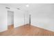 Spacious bedroom with hardwood floors, a ceiling fan, two entryways, and ample natural light at 279 Mark Twain Ln, Rotonda West, FL 33947