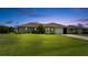 Charming single-story home with a well-maintained lawn and attached garage at 279 Mark Twain Ln, Rotonda West, FL 33947