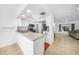 Open kitchen layout with stainless steel appliances offering a seamless flow to the living area at 279 Mark Twain Ln, Rotonda West, FL 33947