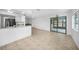 Living room featuring tile flooring and large sliding glass doors at 279 Mark Twain Ln, Rotonda West, FL 33947