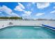 Beautiful pool with cool, clear water, surrounded by a pristine white fence, inviting you for a refreshing swim at 279 Mark Twain Ln, Rotonda West, FL 33947