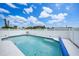 A refreshing pool is enclosed by a crisp white fence, providing a private oasis for relaxation and enjoyment at 279 Mark Twain Ln, Rotonda West, FL 33947