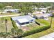 This aerial view shows a cozy home nestled in a well-maintained neighborhood at 305 E Wentworth Cir, Englewood, FL 34223