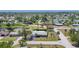 This aerial view shows a cozy home nestled in a well-maintained neighborhood at 305 E Wentworth Cir, Englewood, FL 34223