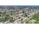 This aerial view shows a cozy home nestled in a well-maintained neighborhood at 305 E Wentworth Cir, Englewood, FL 34223