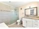 Beautiful bathroom with a glass-enclosed shower, granite countertops, and modern fixtures at 305 E Wentworth Cir, Englewood, FL 34223