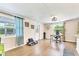 Spacious den with desk, wood floors, and plenty of natural light at 305 E Wentworth Cir, Englewood, FL 34223