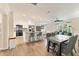 Bright kitchen features an island with bar seating that connects to the dining and living areas at 305 E Wentworth Cir, Englewood, FL 34223