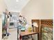 Bright laundry room with washer, dryer, utility sink, and ample storage space at 305 E Wentworth Cir, Englewood, FL 34223
