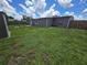 This image shows the backyard and back of the home with a shed at 3157 Crestwood Dr, Port Charlotte, FL 33952
