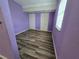 Bedroom with vinyl flooring, a window with blinds, and purple walls at 3157 Crestwood Dr, Port Charlotte, FL 33952