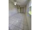 Bright bedroom with tile floors, ample closet space, and a large window for natural light at 3157 Crestwood Dr, Port Charlotte, FL 33952