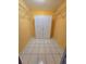 Bright, walk-in closet with white wire shelving and white flooring at 3157 Crestwood Dr, Port Charlotte, FL 33952