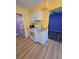 Kitchen with appliances and a view into an adjacent room at 3157 Crestwood Dr, Port Charlotte, FL 33952
