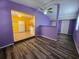 Bright living room with vinyl flooring, colorful walls, and a ceiling fan at 3157 Crestwood Dr, Port Charlotte, FL 33952