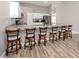 Kitchen with granite countertops, white cabinets, stainless steel appliances, and a breakfast bar at 3695 Waffle Ter, North Port, FL 34286