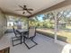 Covered lanai ideal for outdoor dining or relaxation, overlooking a serene backyard at 3695 Waffle Ter, North Port, FL 34286