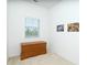 Cozy bedroom featuring a wooden chest and a window at 3929 Cape Haze Dr # 101, Rotonda West, FL 33947
