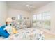 Bright bedroom with coastal themed decor, twin beds and two windows at 3929 Cape Haze Dr # 101, Rotonda West, FL 33947