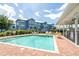 Beautiful community pool area with lounge chairs, tables, and well-maintained landscaping at 3929 Cape Haze Dr # 101, Rotonda West, FL 33947