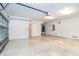 Expansive garage featuring an automatic door and storage space with access doors to the home's interior at 3929 Cape Haze Dr # 101, Rotonda West, FL 33947