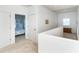 Upstairs hallway with view into one of the bedrooms at 3929 Cape Haze Dr # 101, Rotonda West, FL 33947