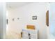 Light-filled hallway with small desk and large windows, creating a versatile workspace at 3929 Cape Haze Dr # 101, Rotonda West, FL 33947