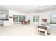 Bright and open living area with sliding glass doors leading to an outdoor space at 3929 Cape Haze Dr # 101, Rotonda West, FL 33947